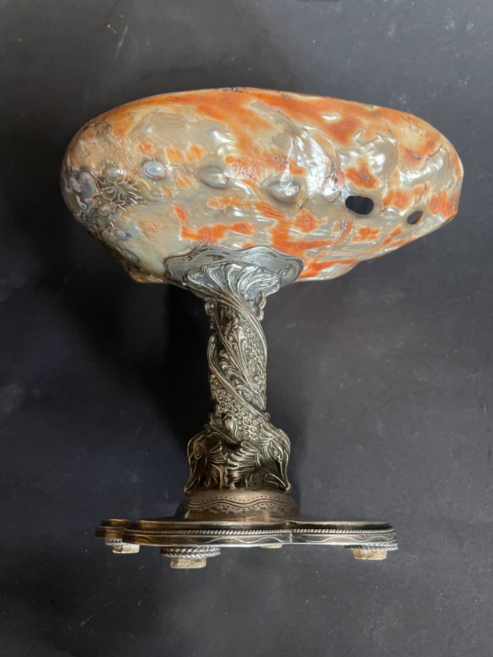 An antique abalone shell dish mounted on a relief-carved silvered metal pedestal with a lobed base. View VII