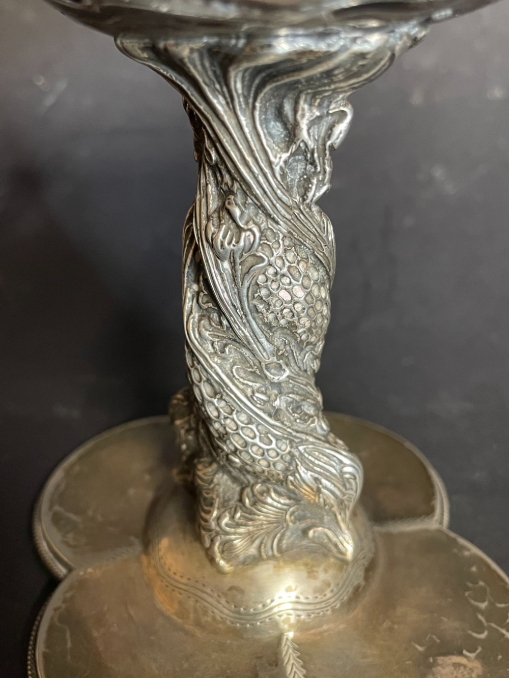 An antique abalone shell dish mounted on a relief-carved silvered metal pedestal with a lobed base. View X