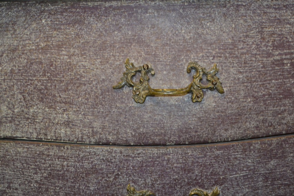 A small French-style three-drawer commode with a distressed grey paint finish, curved cabriole legs, decorative brass handles, and a veined marble top. View VIII