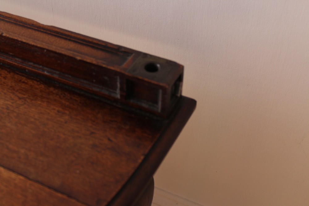 A 19th-century dark wood demi-lune table featuring a semicircular top, a low rear gallery edge, and four shaped legs. View VI