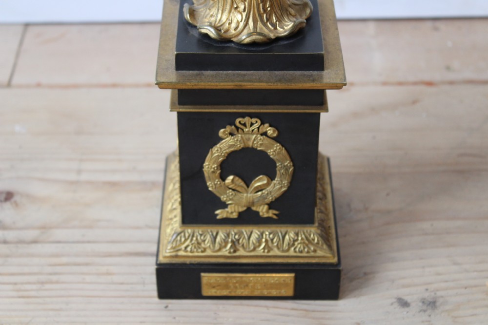 A French Empire style column table lamp made from dark metal and gilt brass with a fluted shaft, laurel wreath pedestal base, and upper shade frame. View V