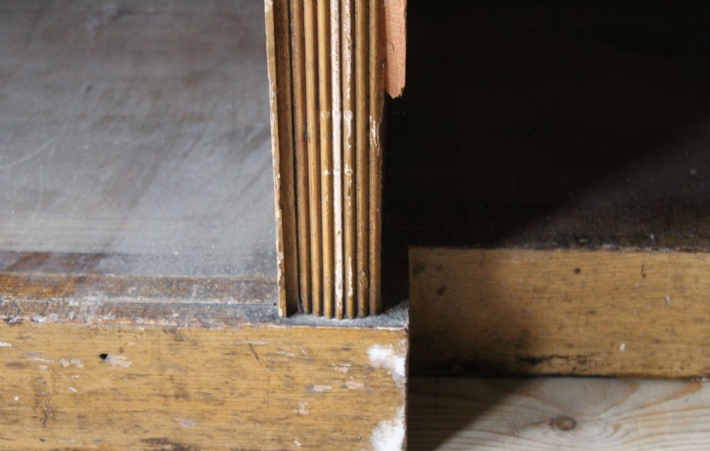A large nineteenth-century open pine bookcase featuring three upper shelving sections set above three deeper lower compartments. View IV
