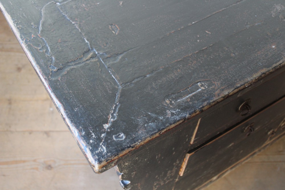A 19th-century distressed black painted wooden chest featuring five drawers over a double door cabinet with metal ring handles. View VI