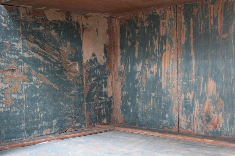 A 19th-century tall pine kitchen cupboard featuring a distressed blue painted finish, upper panelled doors, middle drawers, and lower cabinet doors. View VII