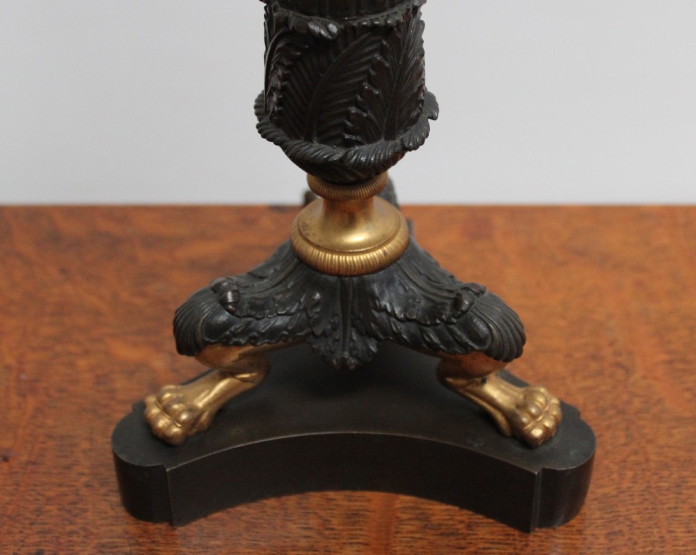A 19th-century French Empire style table lamp featuring a dark patinated fluted column, gilt metal accents, and a triform base with paw feet. View IV