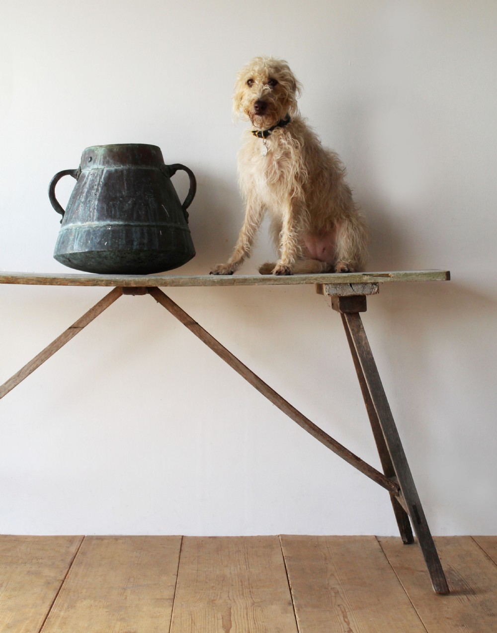 A late 19th-century rustic wooden wash table featuring splayed legs, diagonal cross bracing, and a weathered pine surface. View II