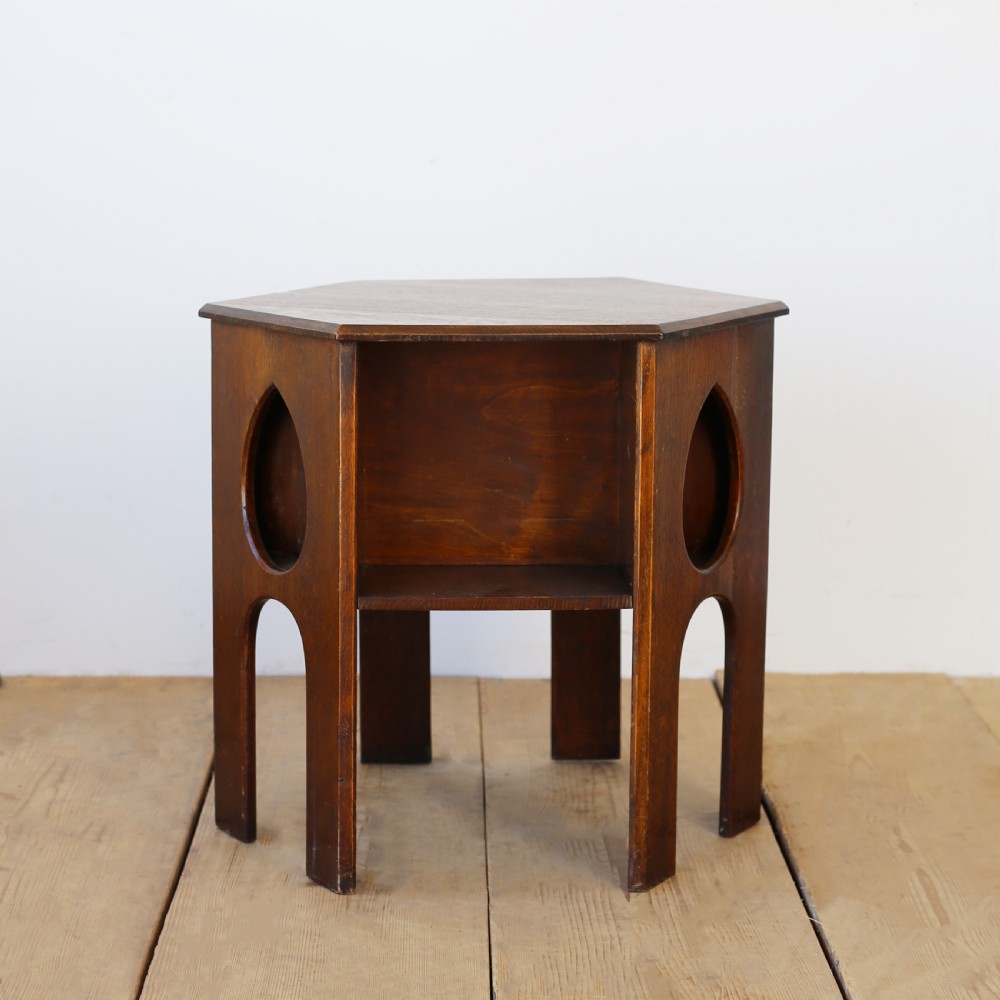 A 19th-century oak hexagonal side table featuring teardrop-shaped pierced cut-outs, an open lower shelf, and straight legs. View II
