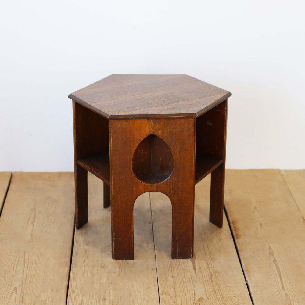 A 19th-century oak hexagonal side table featuring teardrop-shaped pierced cut-outs, an open lower shelf, and straight legs. View III