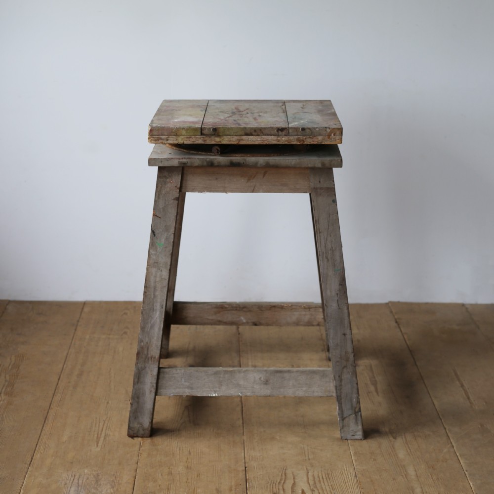 A 19th-century weathered wooden sculptors stand featuring a square revolving top supported by four tapered legs and cross-stretchers. View III