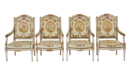fig 1. A five-piece French giltwood salon suite comprising four carved armchairs and a matching sofa, all upholstered in cream woven tapestry with floral and figurative medallions.