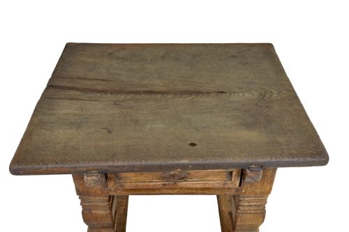 fig 1. A 17th-century Flemish carved oak side table featuring a frieze drawer, turned legs, and a lower box stretcher.