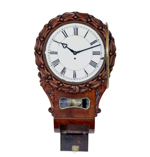 fig 1. A mid-19th century Victorian mahogany fusee wall clock featuring a hand-carved foliate surround, white dial with Roman numerals, and a lower pendulum window.