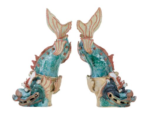fig 1. A pair of 19th-century Japanese glazed ceramic Shachihoko roof ornaments depicting dragon-headed carp with raised tails in green, red, and cream glazes.