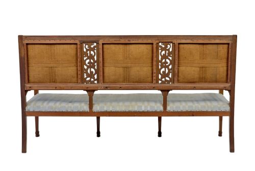 fig 3. An early twentieth-century seven-piece Empire Revival walnut salon suite comprising a bench, two armchairs, and four side chairs with carved serpent back splats.