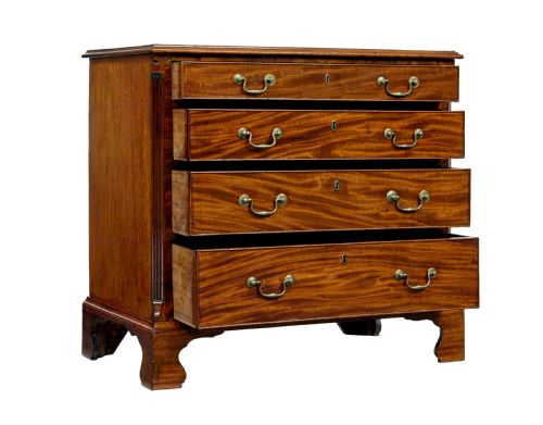 fig 1. An early 19th-century Georgian mahogany chest of drawers featuring four graduated drawers with brass swan-neck handles and bracket feet.