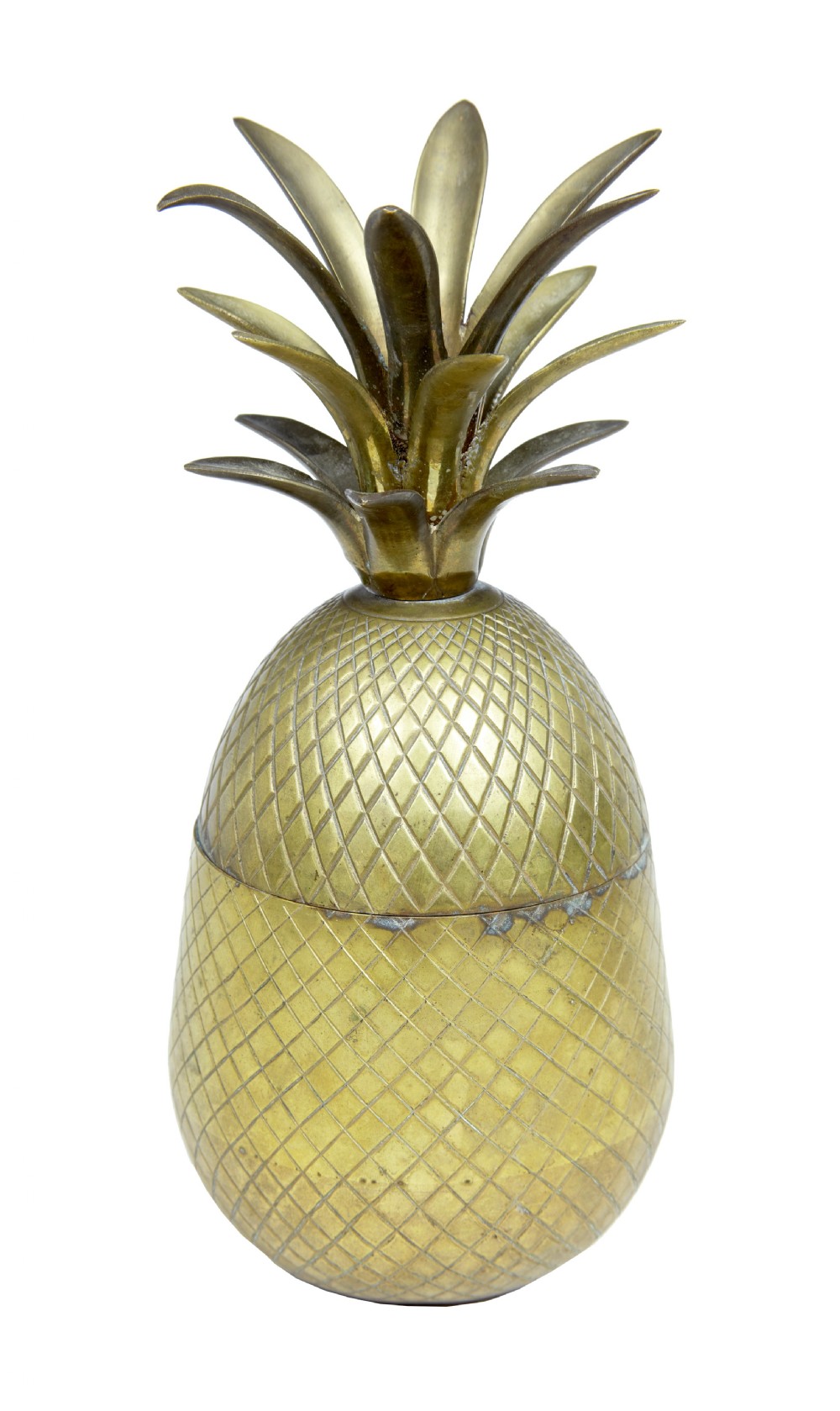 A chiselled brass lidded box shaped like a pineapple with leaf crown detailing.
