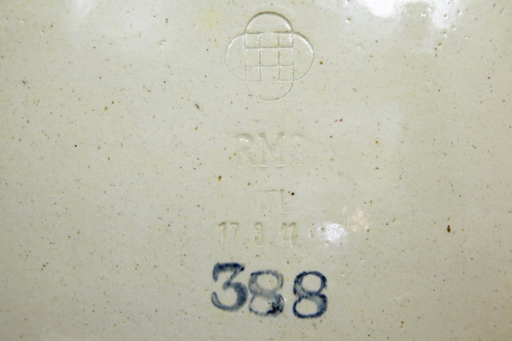 A pair of large cream glazed stoneware alcohol jars featuring hooded lug handles, lower spigot holes, and fitted lids. View II