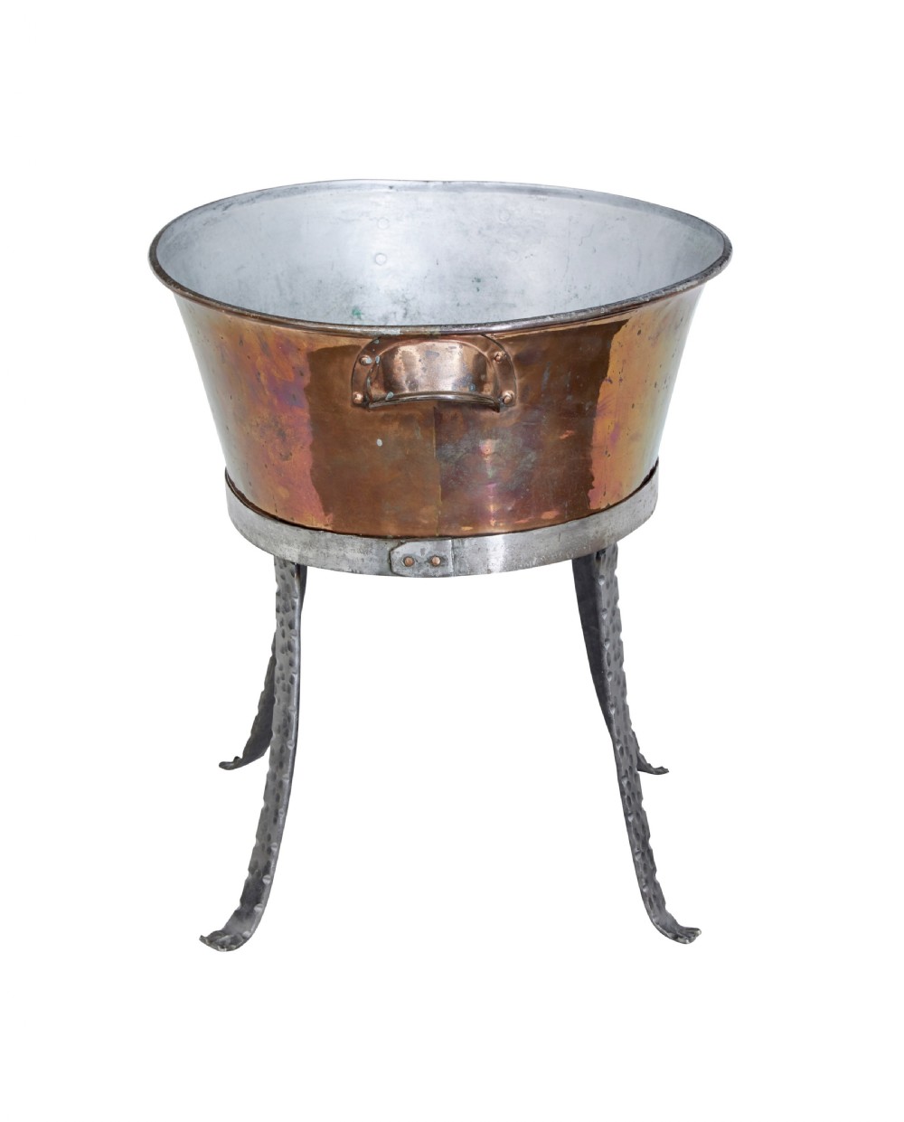 An oval copper basin with a silver-coloured lining and side handles, elevated on a four-legged hammered wrought iron stand. View III