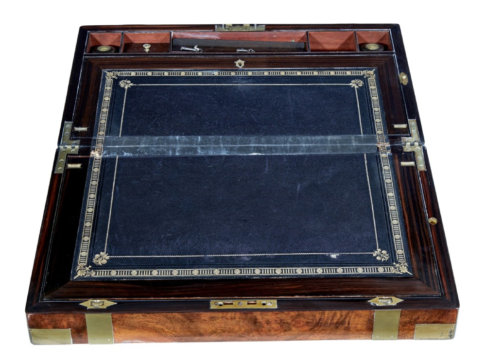 A 19th-century mahogany writing slope featuring polished brass corner mounts, horizontal brass bands, and a central engraved brass plaque. View II