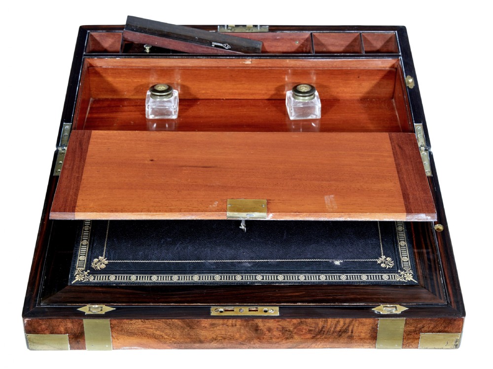 A 19th-century mahogany writing slope featuring polished brass corner mounts, horizontal brass bands, and a central engraved brass plaque. View III
