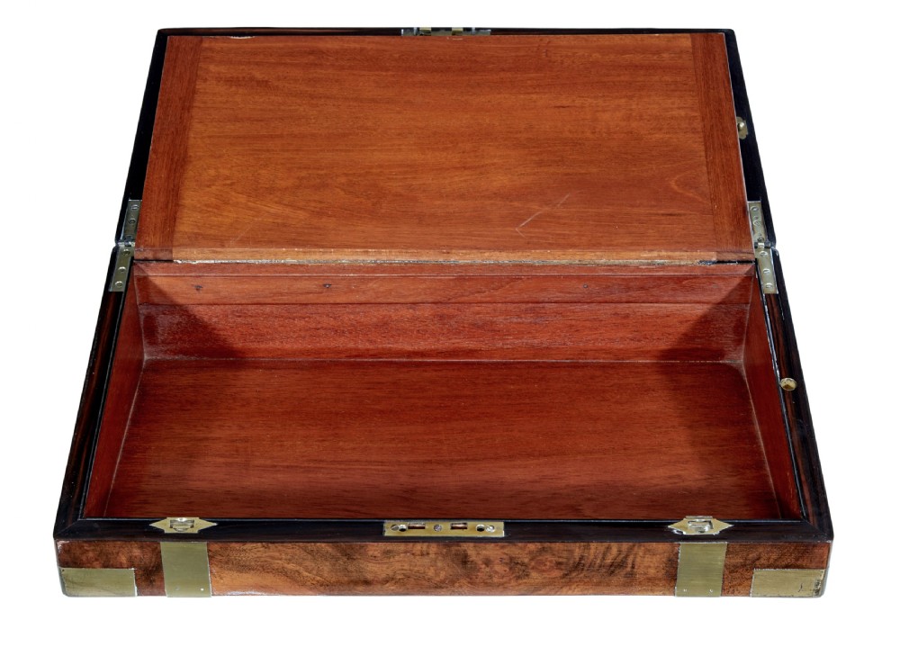 A 19th-century mahogany writing slope featuring polished brass corner mounts, horizontal brass bands, and a central engraved brass plaque. View IV