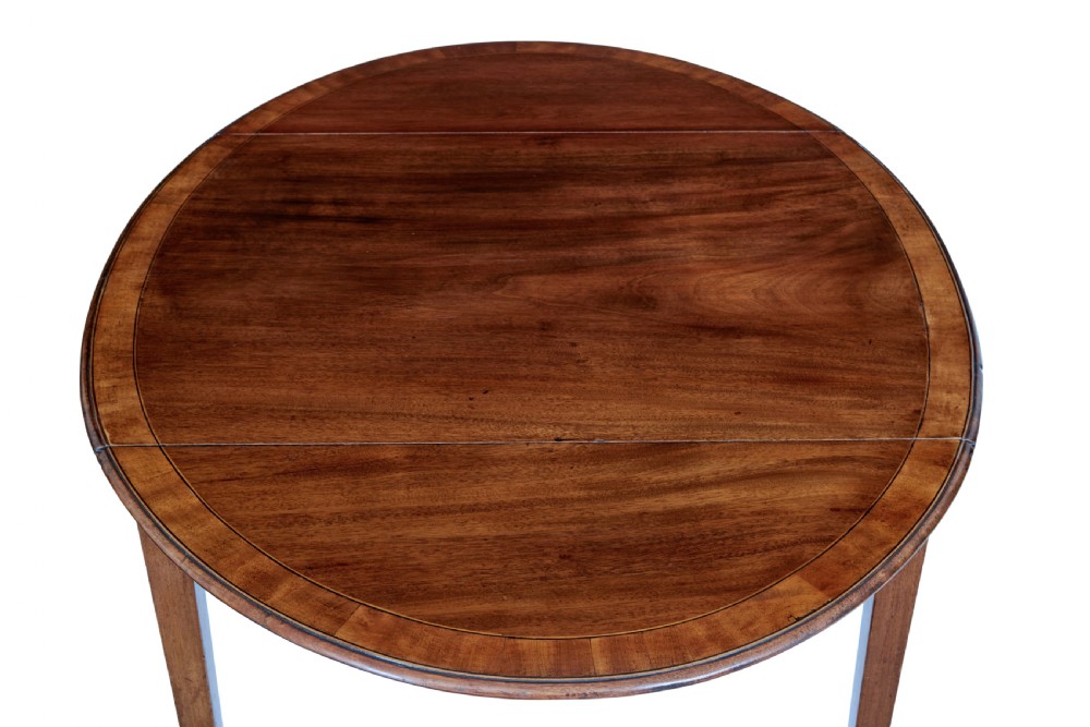 A 19th-century Regency mahogany Pembroke table featuring two hinged drop leaves, a single frieze drawer with a brass handle, and four tapered square legs. View V