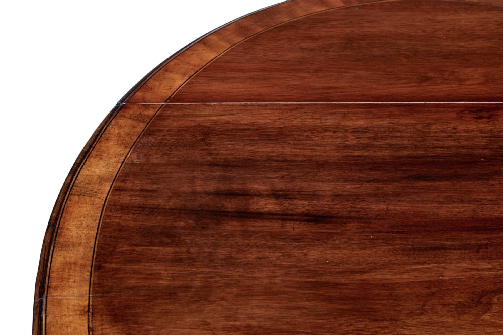 A 19th-century Regency mahogany Pembroke table featuring two hinged drop leaves, a single frieze drawer with a brass handle, and four tapered square legs. View VI