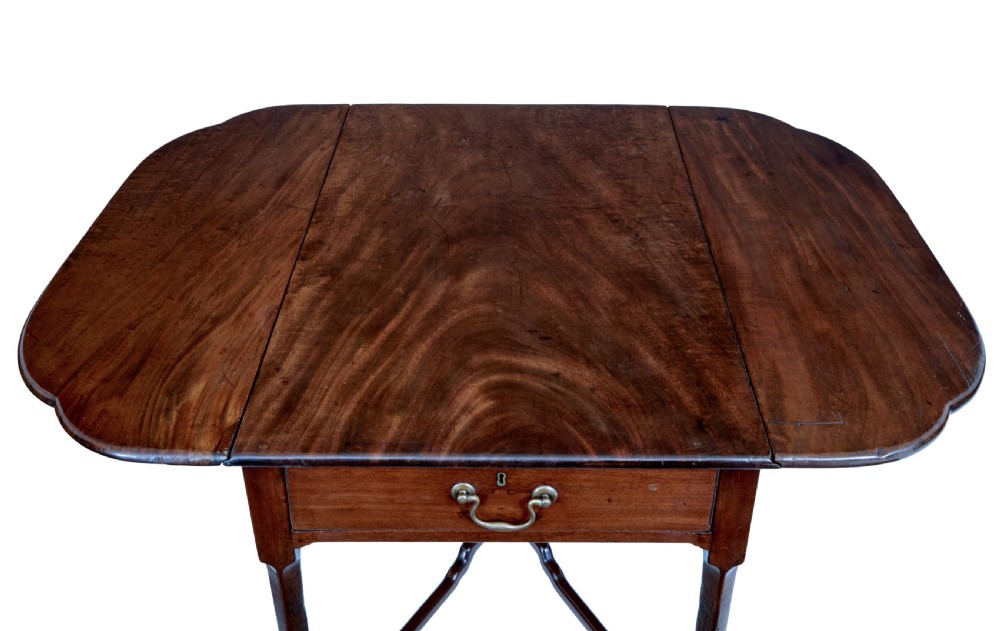 An 18th-century Chippendale mahogany Pembroke table featuring rounded drop leaves, a single end drawer with a brass handle, and an X-frame stretcher. View VI