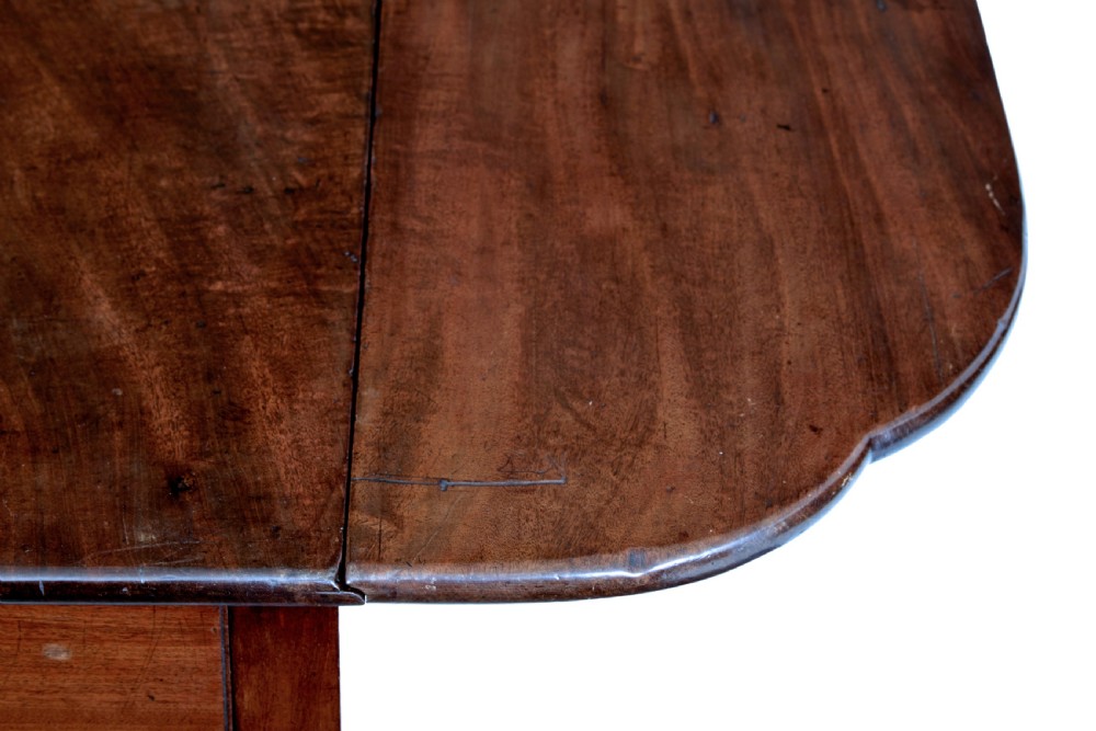 An 18th-century Chippendale mahogany Pembroke table featuring rounded drop leaves, a single end drawer with a brass handle, and an X-frame stretcher. View VII