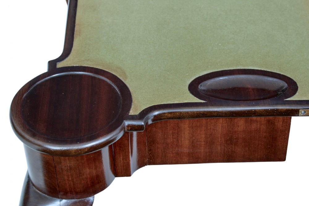 A 19th-century mahogany Chippendale Revival card table featuring a serpentine fold-over top, carved cabriole legs, and ball-and-claw feet. View V