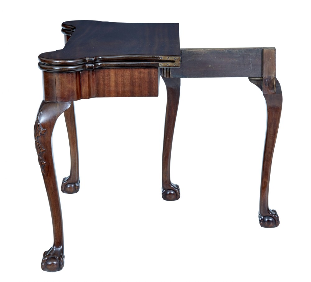 A 19th-century mahogany Chippendale Revival card table featuring a serpentine fold-over top, carved cabriole legs, and ball-and-claw feet. View VII