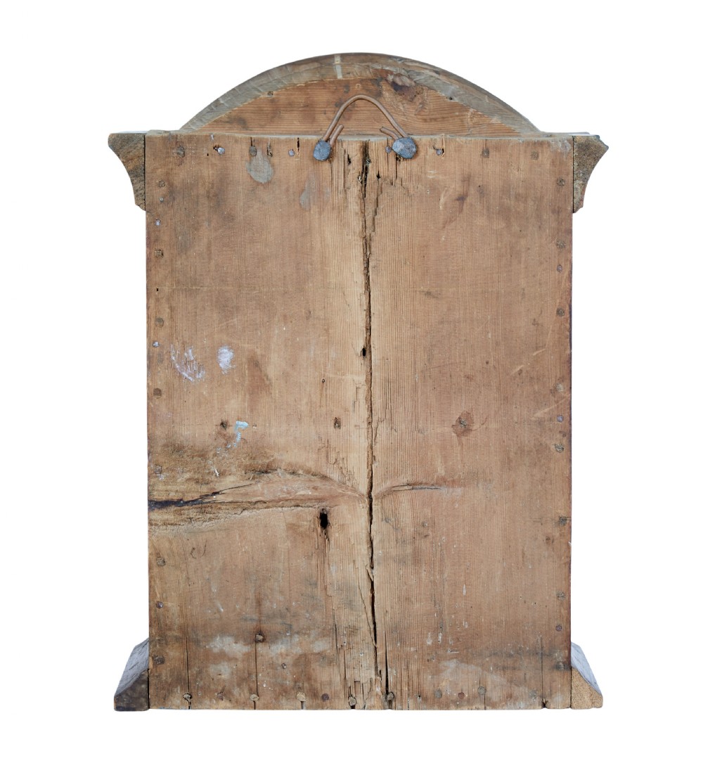 An early 19th-century Swedish painted wall cupboard featuring an arched crest, dark teal trim, and painted floral motifs in terracotta and ochre with the date 1822. View V