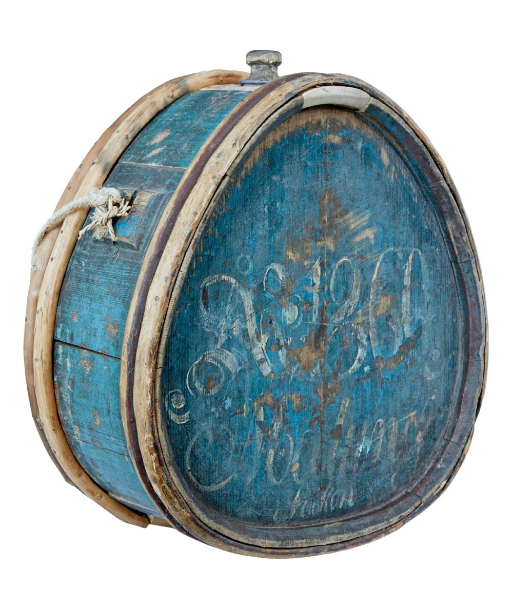 A mid-19th century oval Swedish wooden water carrier featuring blue paint, white hand-script lettering, bentwood hoops, and a wooden stopper.