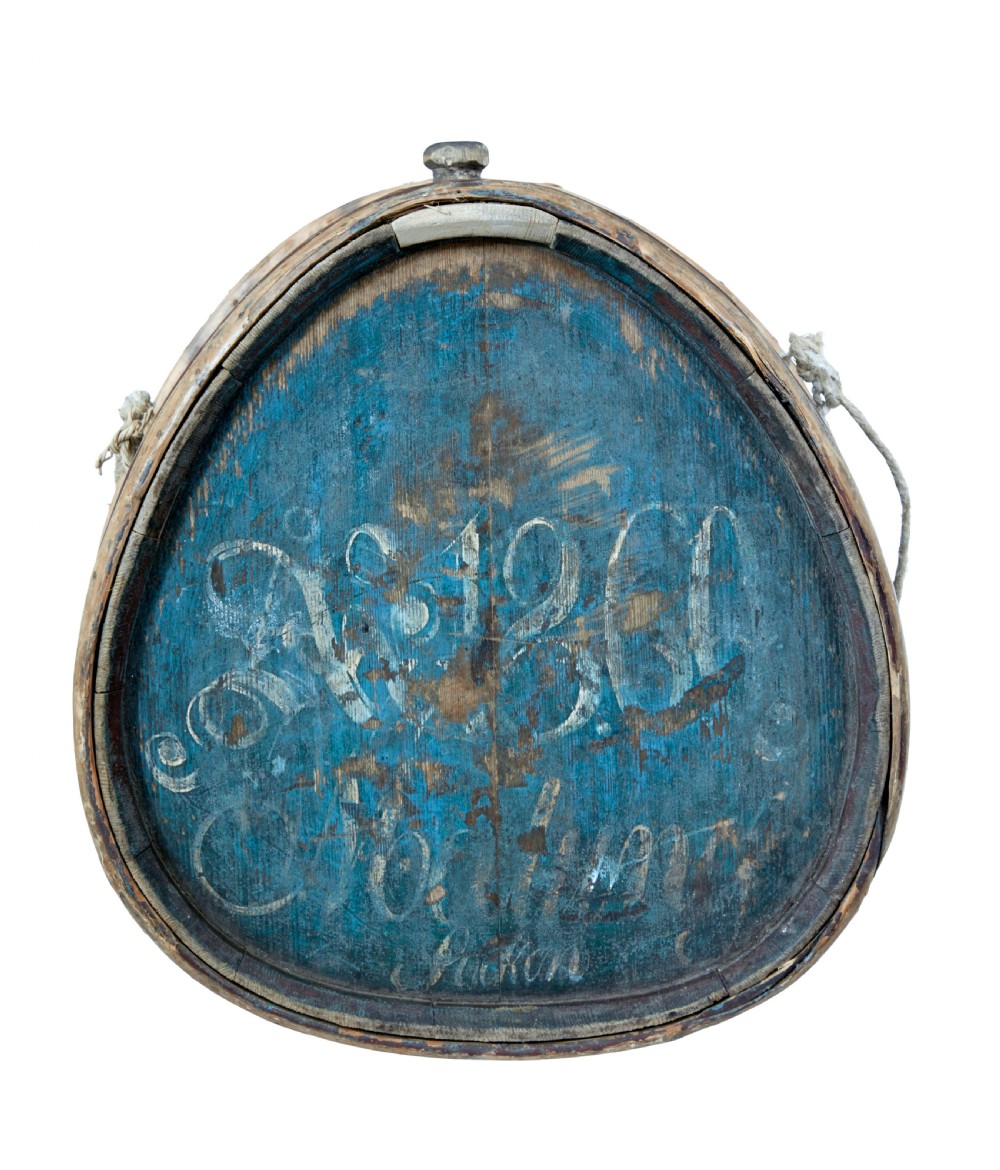 A mid-19th century oval Swedish wooden water carrier featuring blue paint, white hand-script lettering, bentwood hoops, and a wooden stopper. View II
