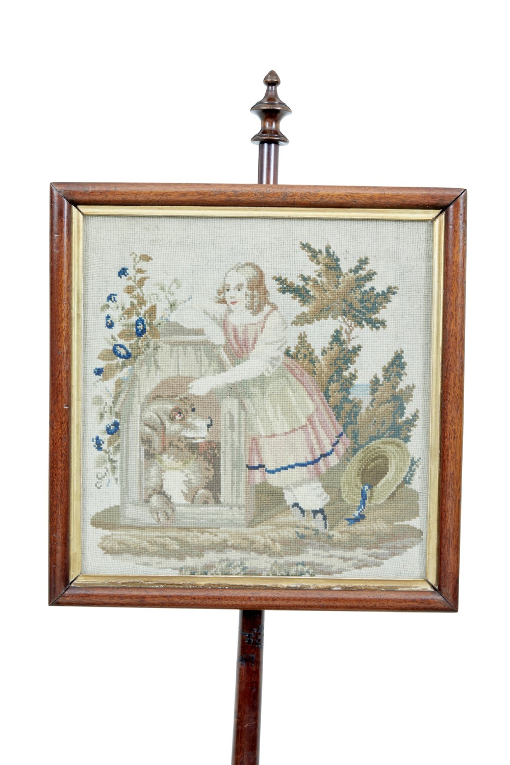 A nineteenth-century William IV mahogany pole screen featuring an adjustable square needlepoint panel depicting a child and dog, supported by a turned column and triform base. View III