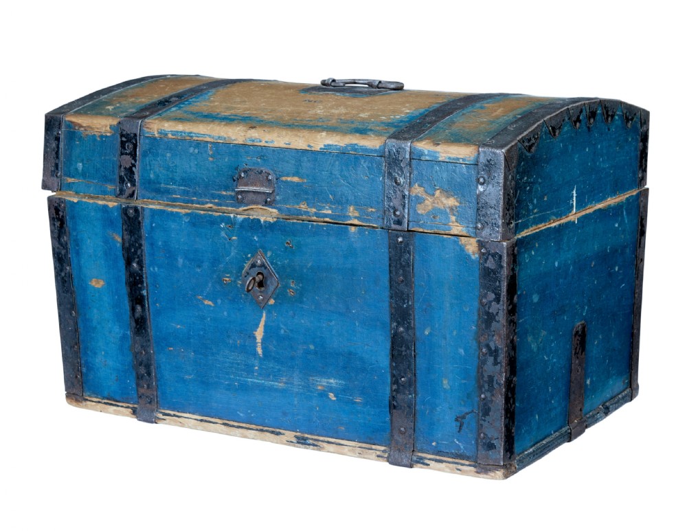 A nineteenth-century Swedish pine box with a domed lid, distressed blue paint finish, and black iron binding straps.