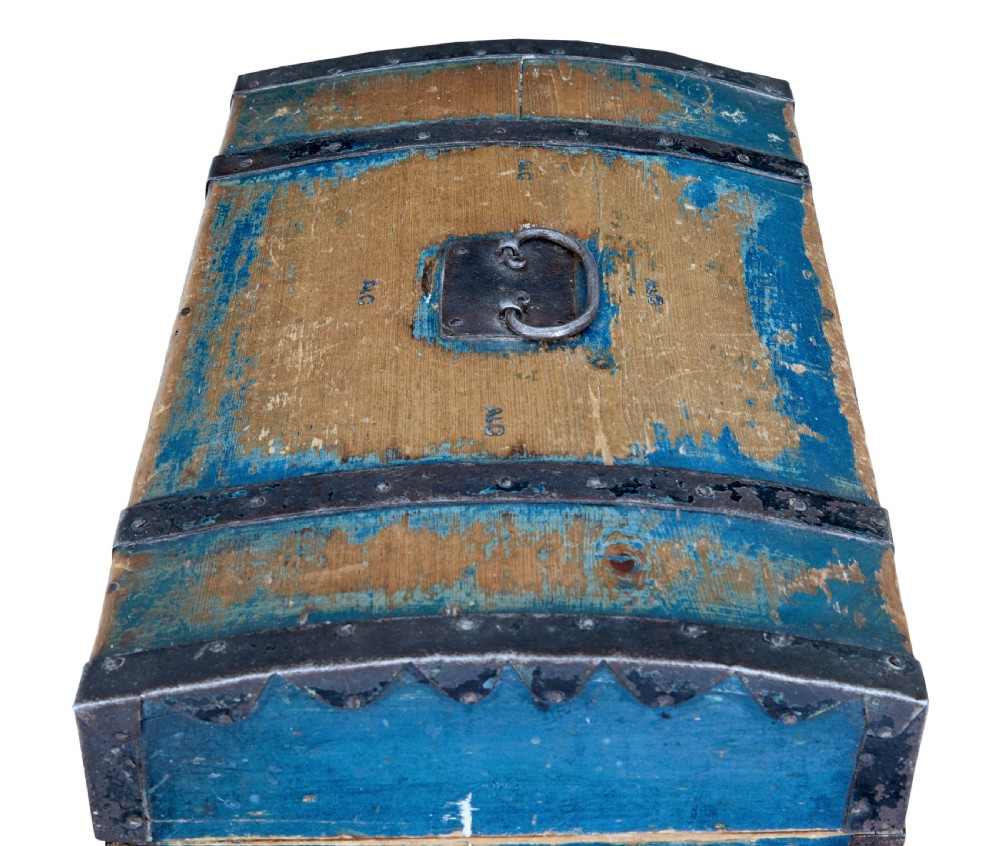 A nineteenth-century Swedish pine box with a domed lid, distressed blue paint finish, and black iron binding straps. View VI