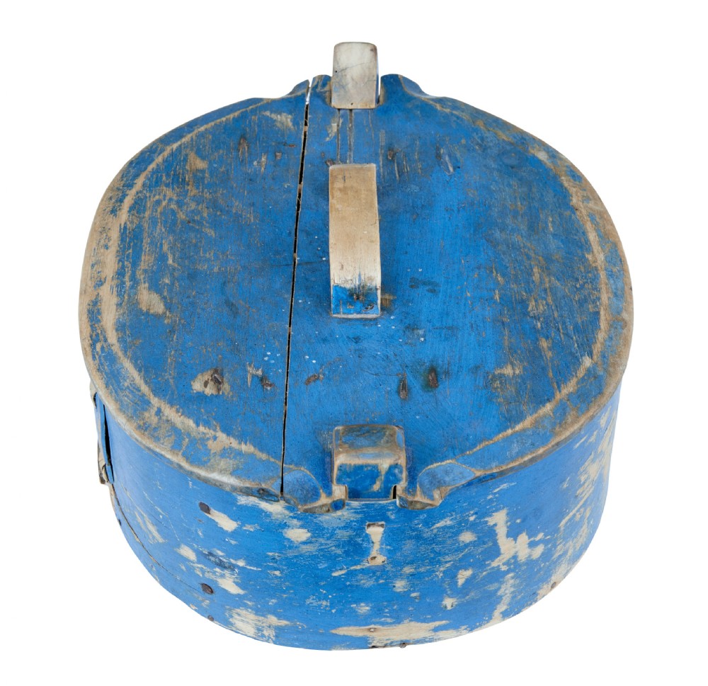 A 19th-century oval wooden tine box featuring distressed blue paint, vertical end pegs, a bentwood top handle, and root lacing. View II