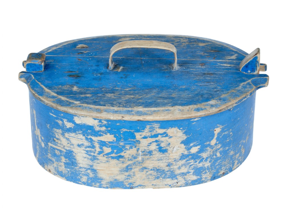 A 19th-century oval wooden tine box featuring distressed blue paint, vertical end pegs, a bentwood top handle, and root lacing. View VI