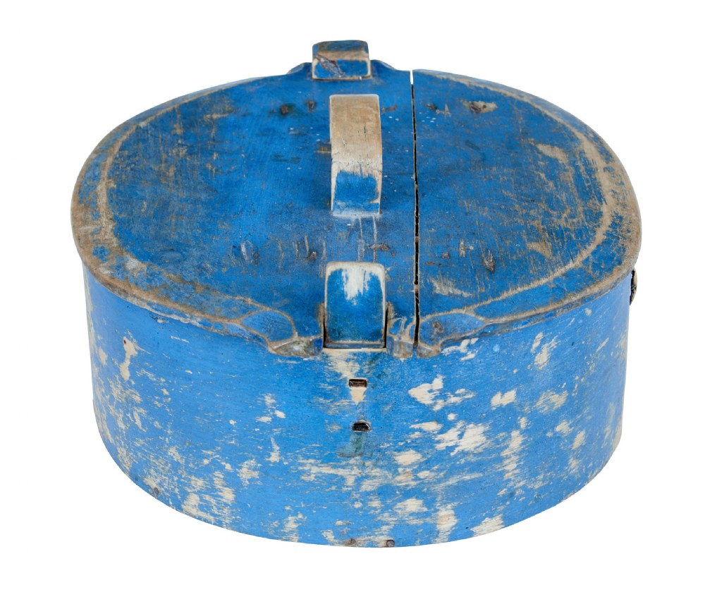 A 19th-century oval wooden tine box featuring distressed blue paint, vertical end pegs, a bentwood top handle, and root lacing. View VII