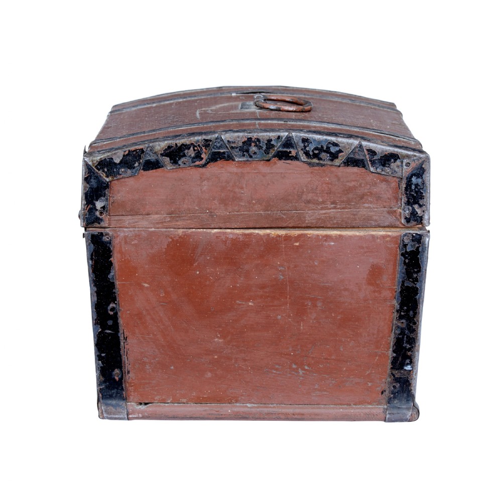 A nineteenth-century Scandinavian pine box featuring a domed lid, terracotta red painted finish, black iron straps, and a central diamond escutcheon with key. View V