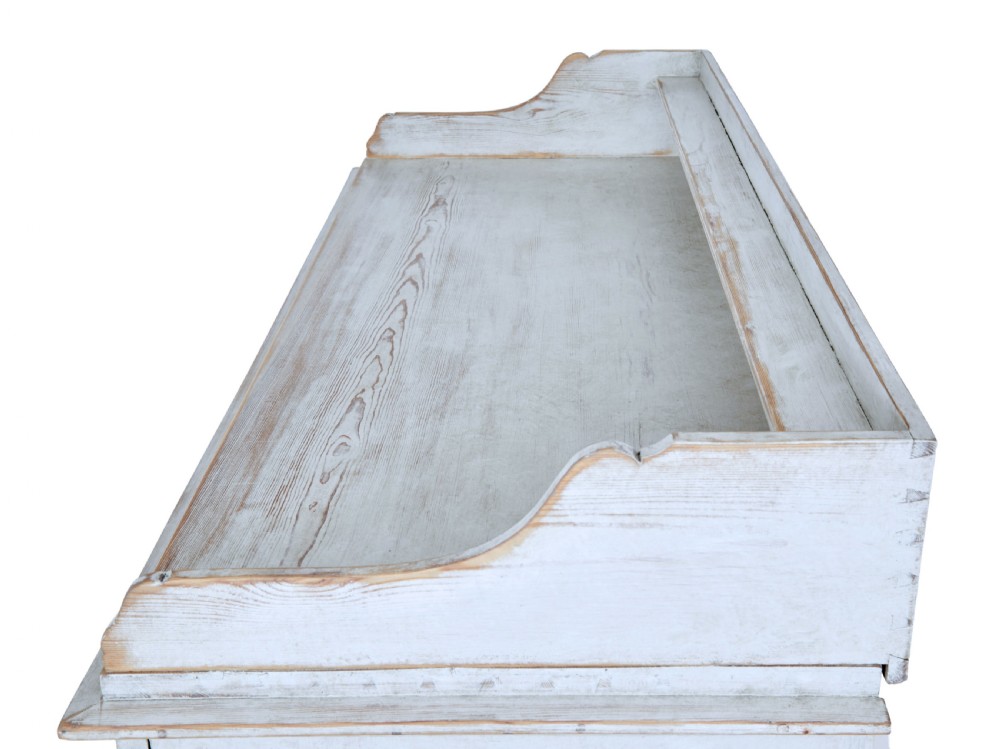 A 19th-century Swedish pine cupboard featuring distressed off-white painted finishes, double doors carved with diamond motifs, tapered short legs, and a low gallery top. View X