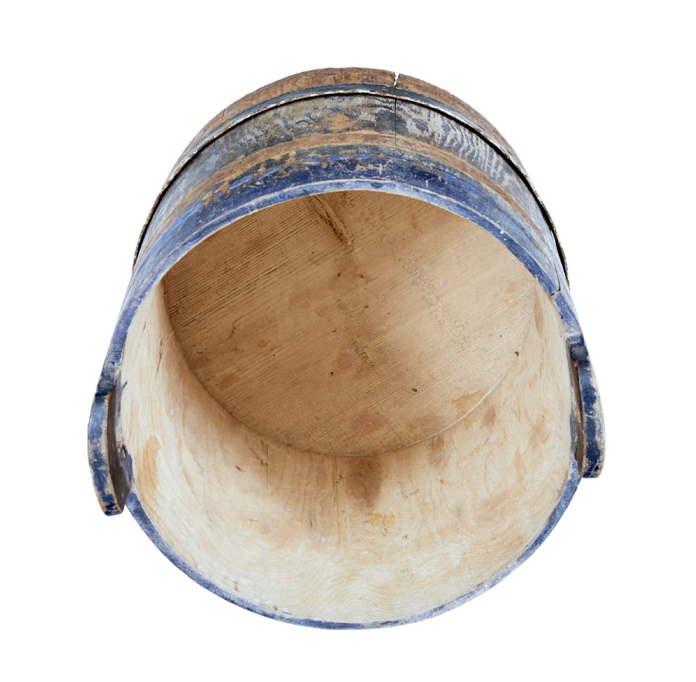A mid-19th-century Swedish pine storage container featuring a distressed blue painted finish, stave construction, and an arched wooden top handle. View VII