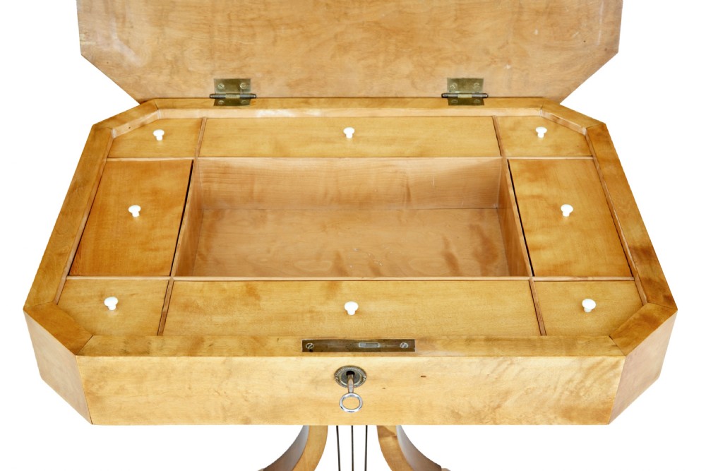 A 19th-century Swedish satin birch occasional table featuring a lyre-shaped pedestal base, a single drawer with a key, and a quadruped plinth. View VIII