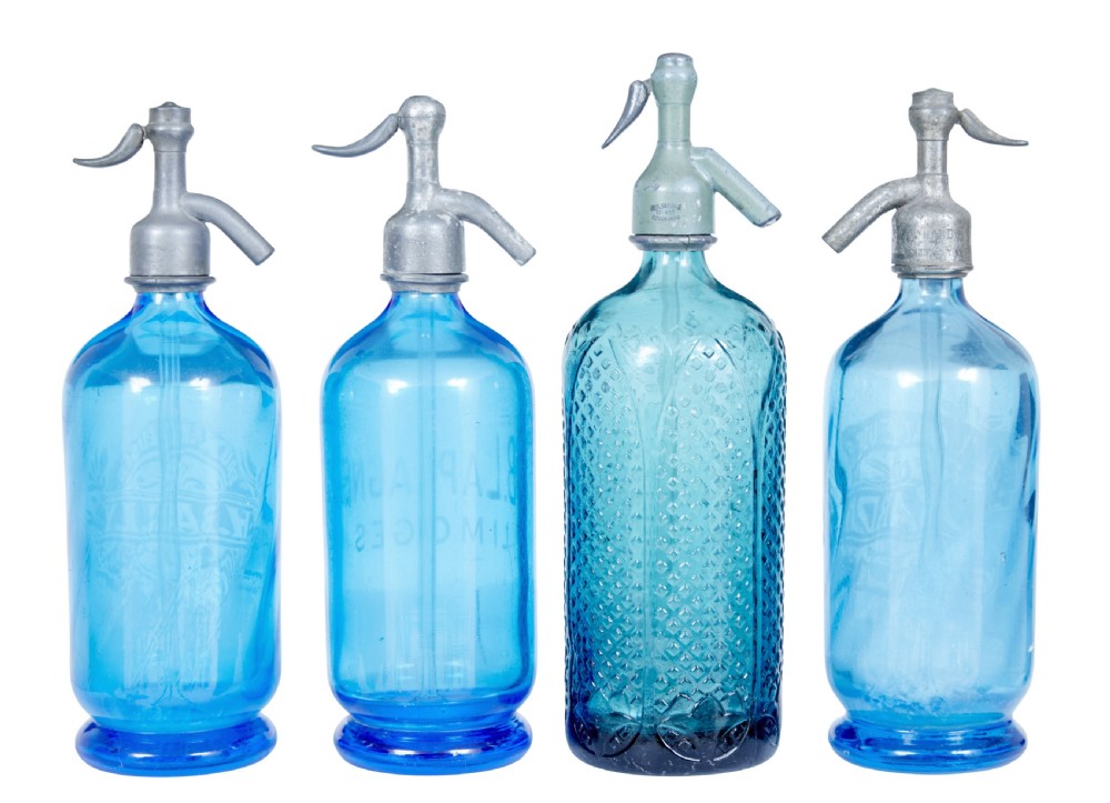A set of four early twentieth-century French bright blue etched glass soda syphons with grey metal tops. View II