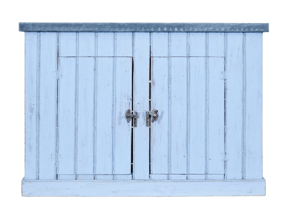 A 19th-century rustic light blue painted pine washstand featuring double planked doors with turn-latch handles and a metal-bound top.