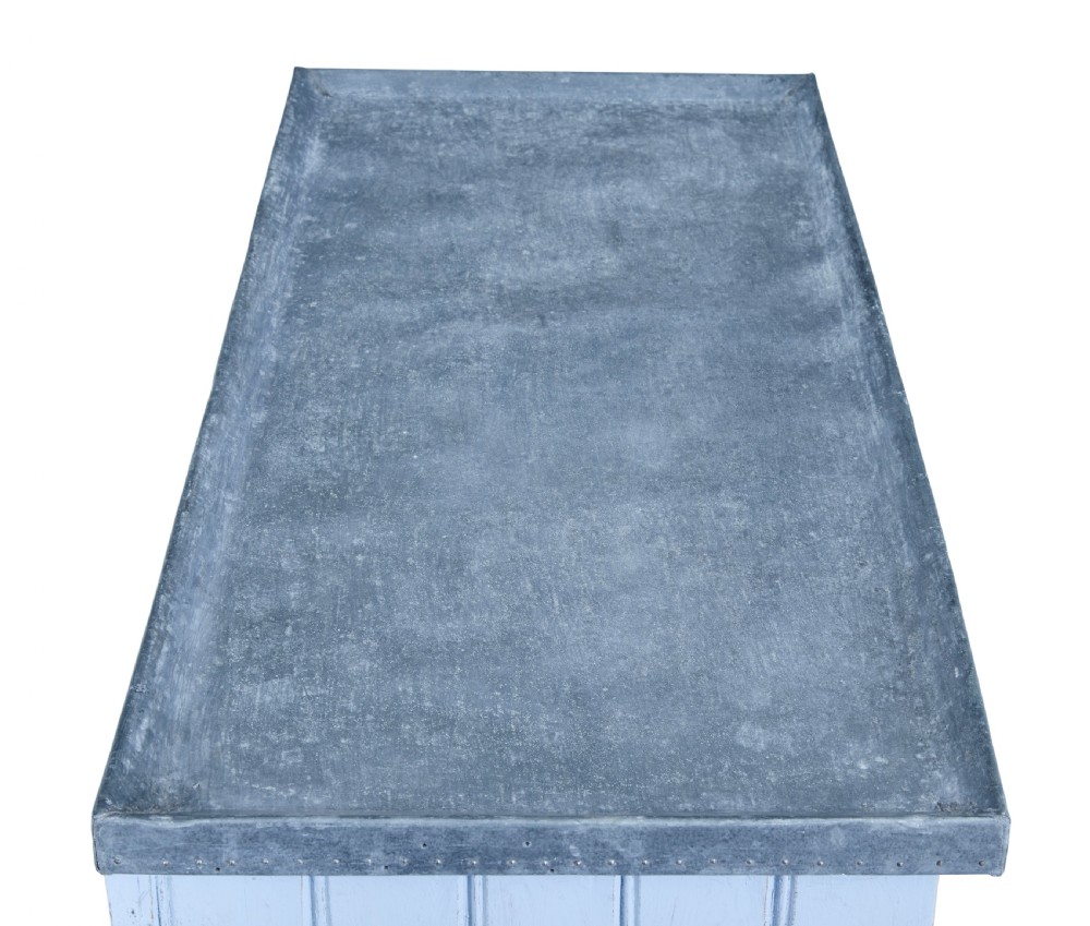 A 19th-century rustic light blue painted pine washstand featuring double planked doors with turn-latch handles and a metal-bound top. View II