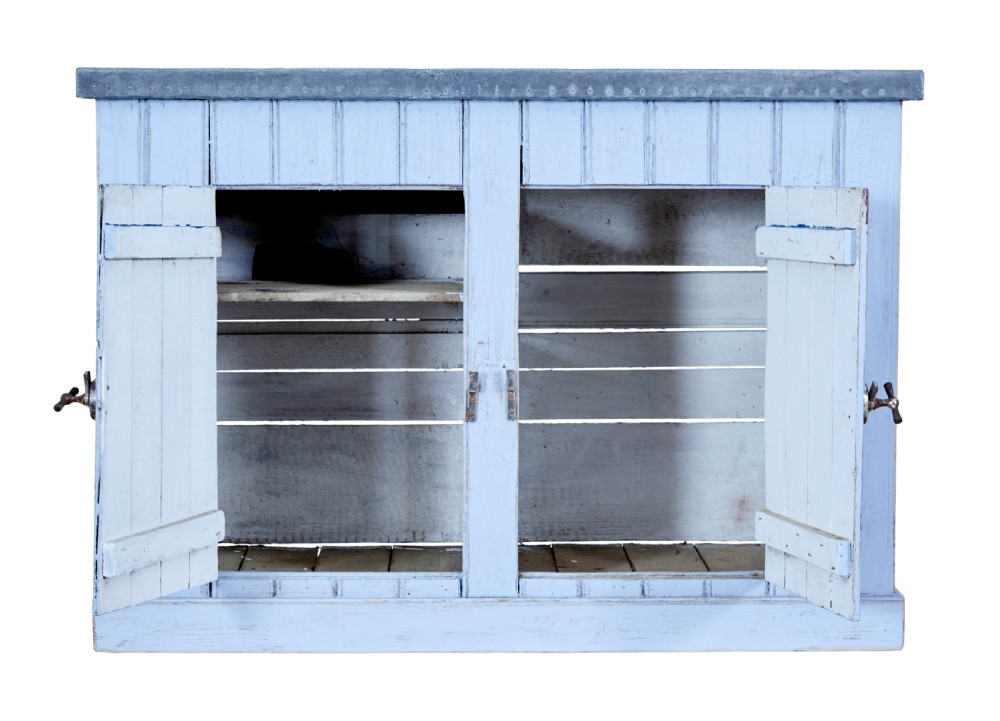A 19th-century rustic light blue painted pine washstand featuring double planked doors with turn-latch handles and a metal-bound top. View IV
