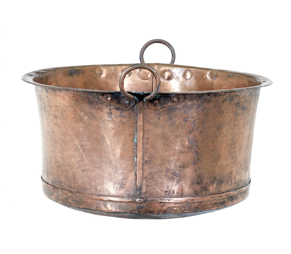 A large 19th-century hammered copper cooking vessel featuring a rounded base, riveted seams, and two wrought iron loop handles. View III