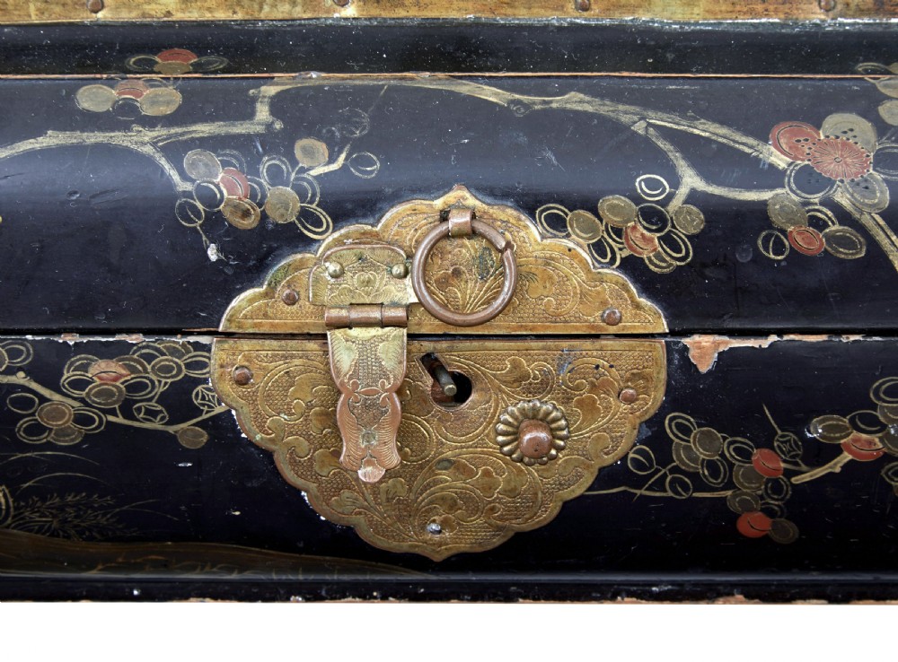A 19th-century black lacquered jewellery box decorated with gilded botanical motifs, an ornate brass clasp, and a pale blue padded silk top. View VII